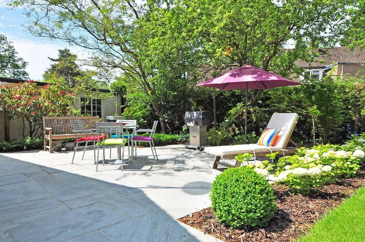 A finished paver patio and lush garden landscaped by Green Patch Landscaping in Gold Canyon, Arizona